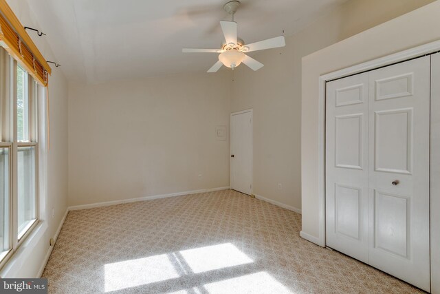 26747 Cat Creek Rd, Mechanicsville, MD 20659 - unfurnished bedroom with carpet, lofted ceiling, a closet, baseboards, and ceiling fan