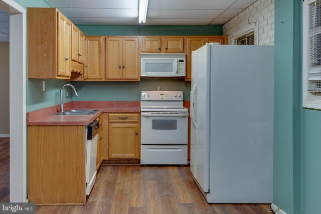 26747 Cat Creek Rd, Mechanicsville, MD 20659 - kitchen with white appliances, a sink, light wood-type flooring, and light brown cabinets