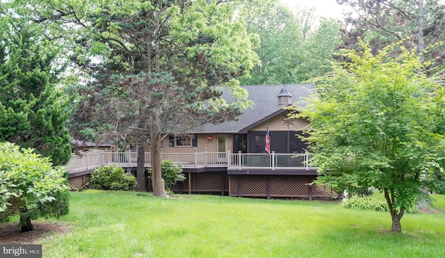 26747 Cat Creek Rd, Mechanicsville, MD 20659 - back of house with a sunroom, a lawn, a shingled roof, and a wooden deck