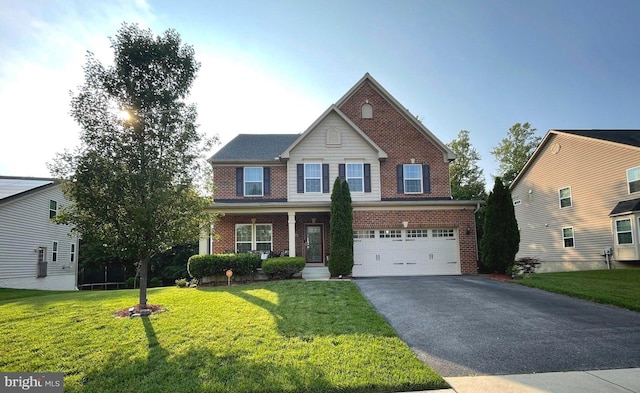 9340 Rock Lynn Cir, Waldorf, MD 20603 - view of front of property with brick siding, a garage, driveway, and a front lawn