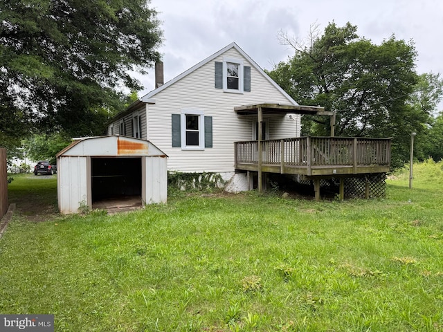 3602 Tulip Ave, Baltimore, MD 21227 - back of house with a deck, a chimney, and a yard