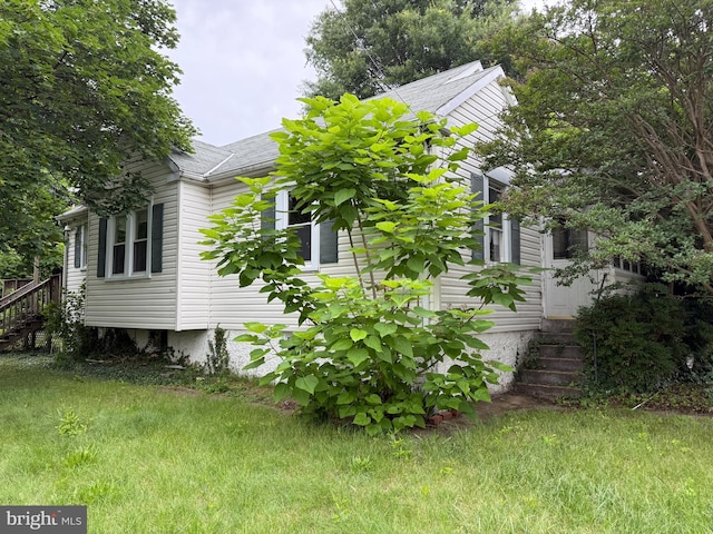 3602 Tulip Ave, Baltimore, MD 21227 - view of home's exterior with stairway and roof with shingles