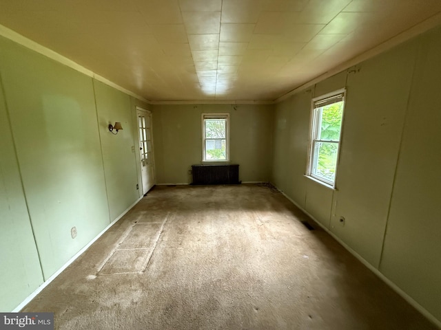 3602 Tulip Ave, Baltimore, MD 21227 - empty room with radiator heating unit, carpet floors, and baseboards