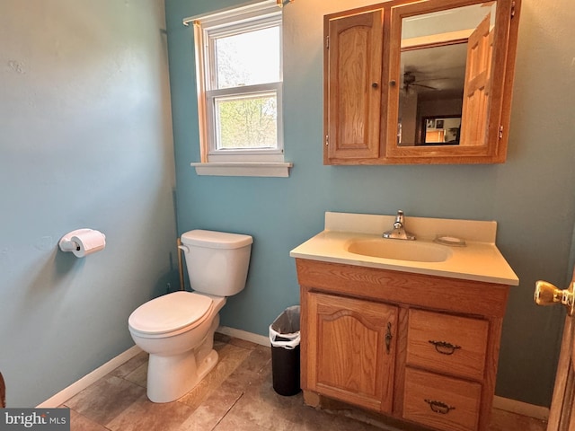 807 Rabbit Ln, Reading, PA 19606 - half bathroom with toilet, vanity, and baseboards