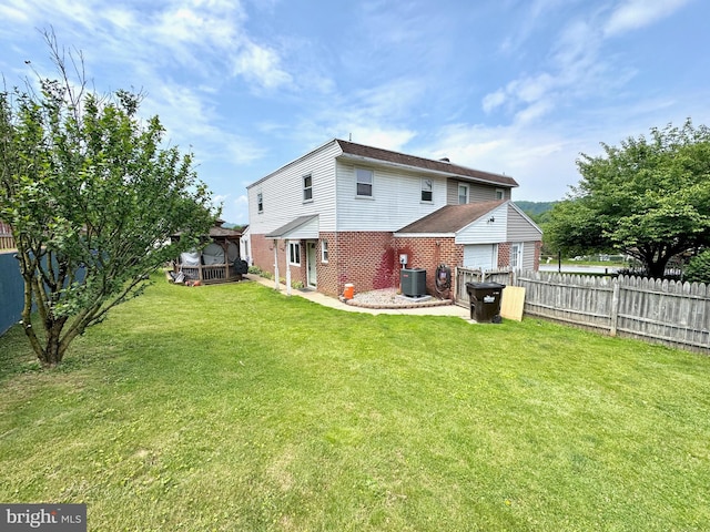 807 Rabbit Ln, Reading, PA 19606 - rear view of house with brick siding and cooling unit