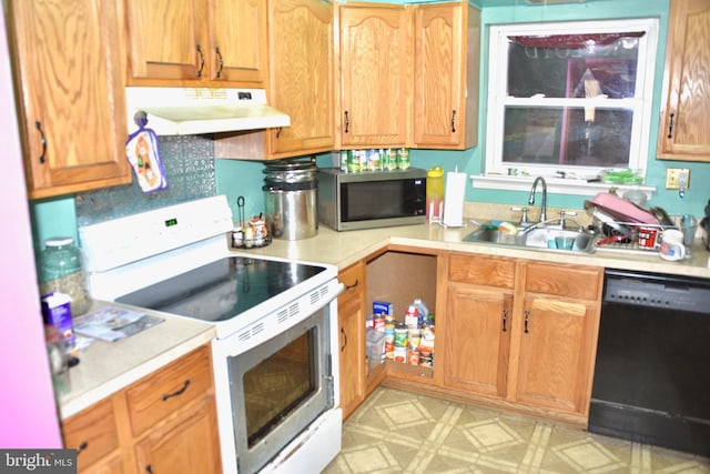 807 Rabbit Ln, Reading, PA 19606 - kitchen featuring electric range, black dishwasher, under cabinet range hood, a sink, and stainless steel microwave