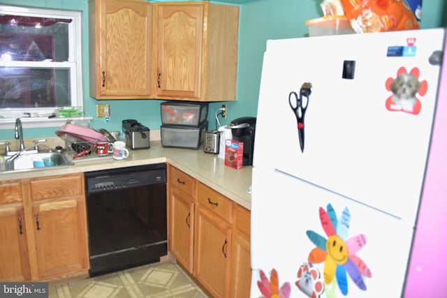 807 Rabbit Ln, Reading, PA 19606 - kitchen with freestanding refrigerator, dishwasher, a sink, and light countertops