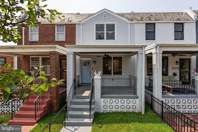 1841 E St NE, Washington, DC 20002 - townhome / multi-family property featuring brick siding, covered porch, a ceiling fan, and a high end roof
