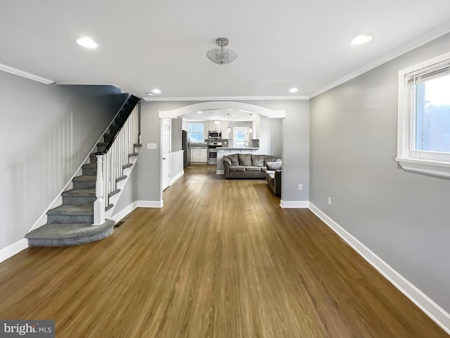 1507 E Duval St, Philadelphia, PA 19138 - living room with arched walkways, stairway, baseboards, dark wood-type flooring, and ornamental molding