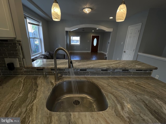 1507 E Duval St, Philadelphia, PA 19138 - kitchen featuring stone counters, a sink, wood finished floors, and pendant lighting