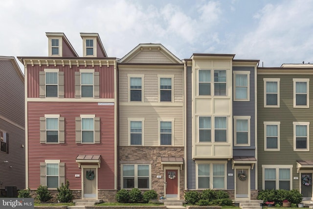 3409 Stone Barn Dr, Frederick, MD 21704 - townhome / multi-family property featuring stone siding and entry steps