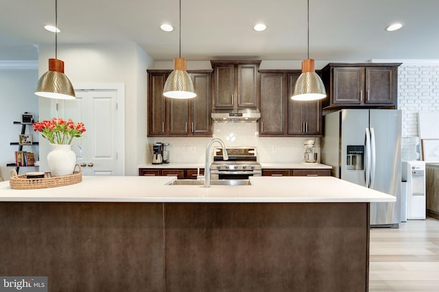 3409 Stone Barn Dr, Frederick, MD 21704 - kitchen with appliances with stainless steel finishes, dark brown cabinets, a sink, under cabinet range hood, and tasteful backsplash