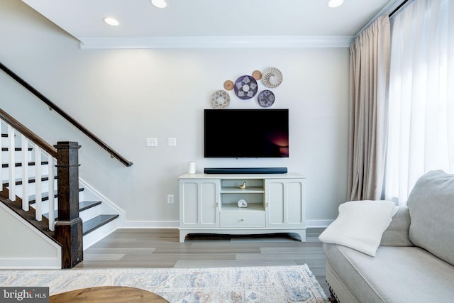 3409 Stone Barn Dr, Frederick, MD 21704 - living area with light wood-type flooring, stairway, recessed lighting, baseboards, and crown molding