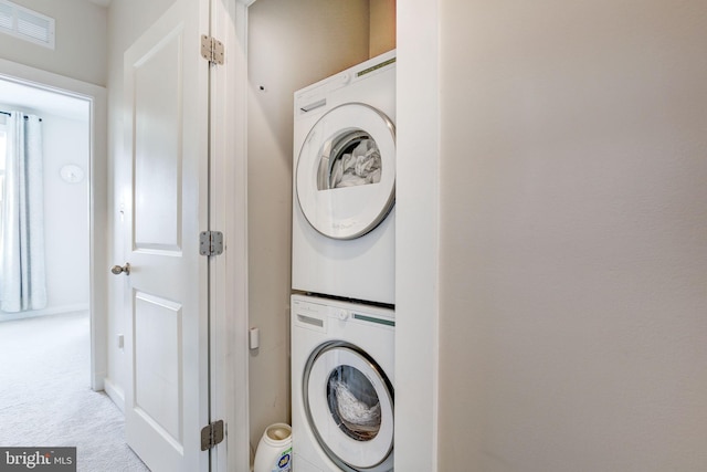 3409 Stone Barn Dr, Frederick, MD 21704 - laundry area with estacked washer and dryer and carpet floors