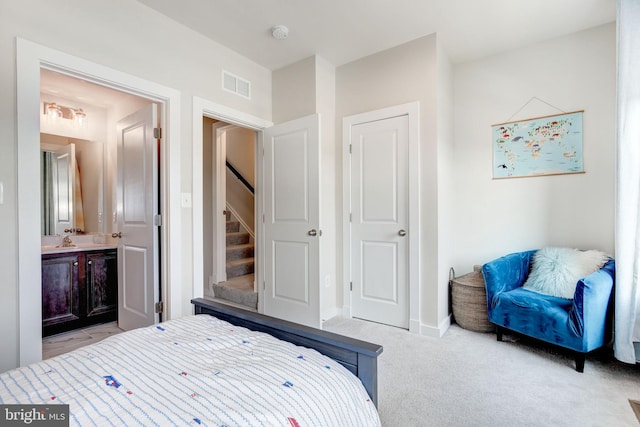 3409 Stone Barn Dr, Frederick, MD 21704 - bedroom with connected bathroom, a sink, light colored carpet, and baseboards