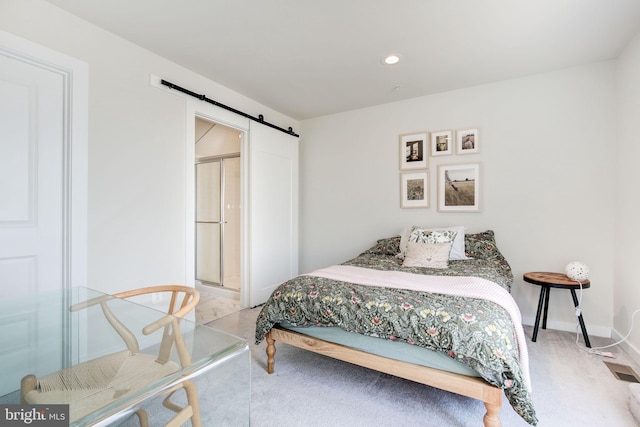 3409 Stone Barn Dr, Frederick, MD 21704 - carpeted bedroom with a barn door, recessed lighting, and baseboards