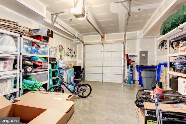 3409 Stone Barn Dr, Frederick, MD 21704 - garage featuring electric panel and a garage door opener