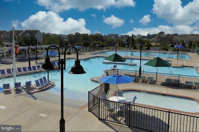 3409 Stone Barn Dr, Frederick, MD 21704 - community pool with a jacuzzi and a patio
