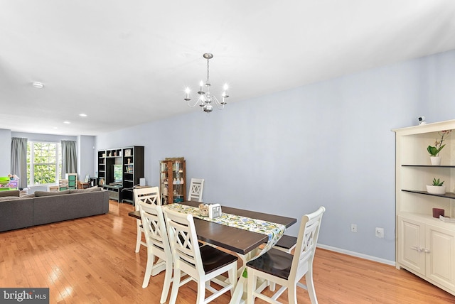 15673 Mendoza Ln, Woodbridge, VA 22191 - dining space with light wood-type flooring and a chandelier