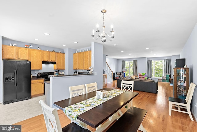 15673 Mendoza Ln, Woodbridge, VA 22191 - dining room featuring stairway, a chandelier, recessed lighting, and light wood-style floors