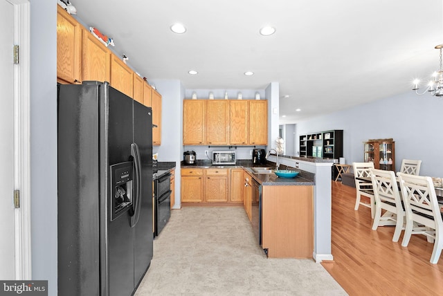 15673 Mendoza Ln, Woodbridge, VA 22191 - kitchen featuring black fridge with ice dispenser, a peninsula, recessed lighting, a chandelier, and stainless steel microwave