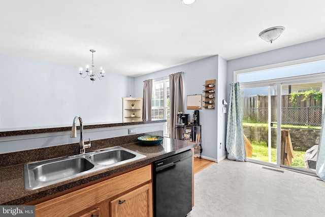 15673 Mendoza Ln, Woodbridge, VA 22191 - kitchen with dishwasher, dark countertops, a chandelier, decorative light fixtures, and brown cabinetry