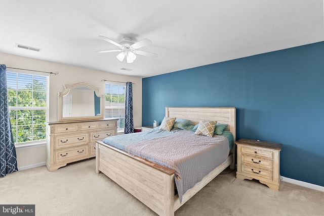 15673 Mendoza Ln, Woodbridge, VA 22191 - bedroom with light carpet, multiple windows, and ceiling fan
