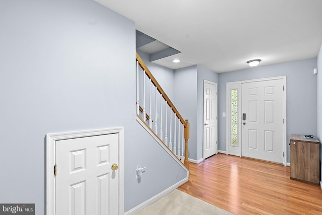 15673 Mendoza Ln, Woodbridge, VA 22191 - entrance foyer with light wood finished floors, stairs, and recessed lighting