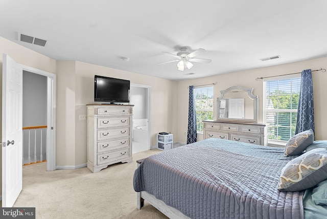 15673 Mendoza Ln, Woodbridge, VA 22191 - bedroom with light carpet, ensuite bath, and ceiling fan
