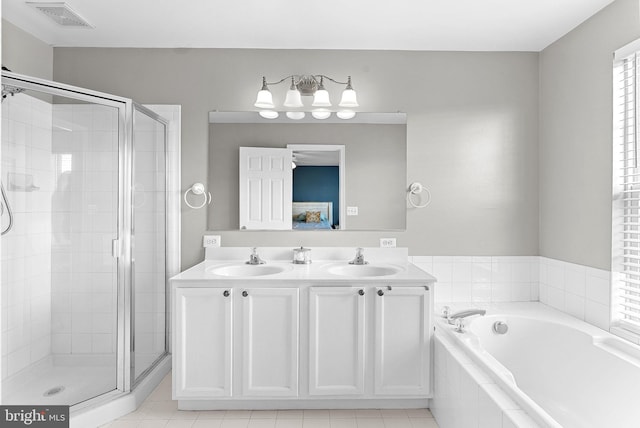 15673 Mendoza Ln, Woodbridge, VA 22191 - bathroom with a stall shower, a garden tub, and double vanity