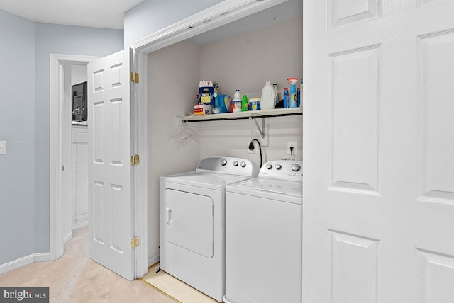 15673 Mendoza Ln, Woodbridge, VA 22191 - laundry room featuring washing machine and dryer and light colored carpet