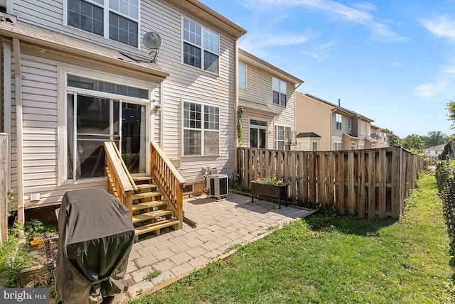 15673 Mendoza Ln, Woodbridge, VA 22191 - rear view of property with entry steps, a patio area, and a residential view