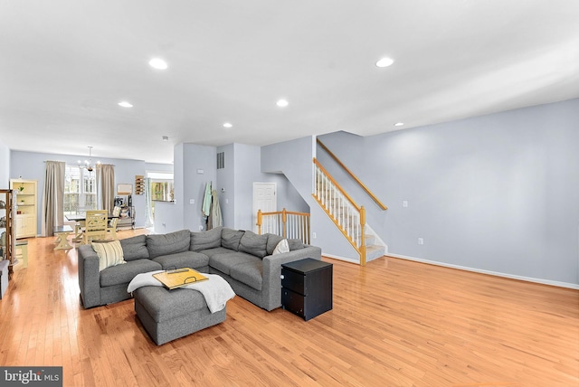 15673 Mendoza Ln, Woodbridge, VA 22191 - living room with light wood-type flooring, stairs, a chandelier, and recessed lighting