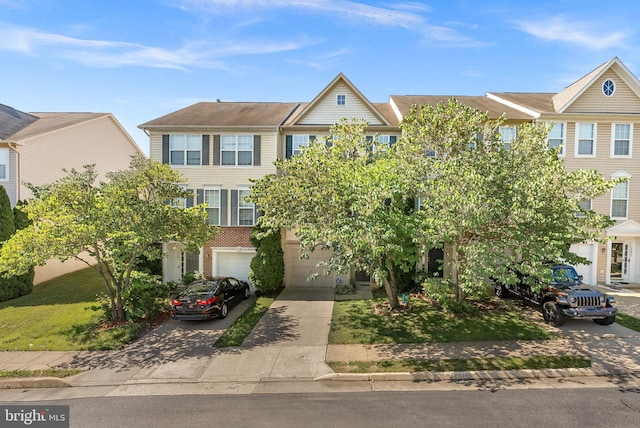 15673 Mendoza Ln, Woodbridge, VA 22191 - multi unit property featuring driveway, a garage, and brick siding