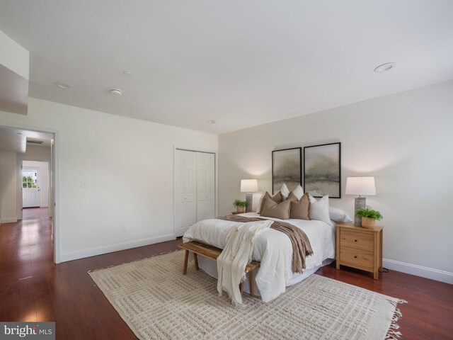 1705 E Chase St, Baltimore, MD 21213 - bedroom with wood finished floors, baseboards, and a closet