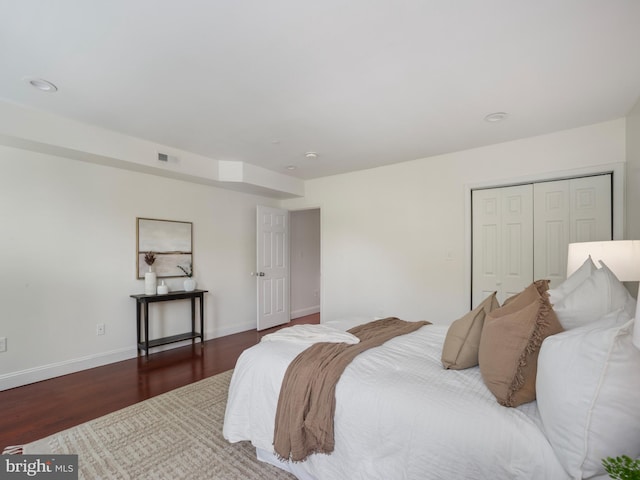 1705 E Chase St, Baltimore, MD 21213 - bedroom with wood finished floors, a closet, and baseboards