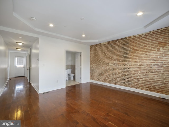1705 E Chase St, Baltimore, MD 21213 - unfurnished room featuring brick wall, baseboards, wood-type flooring, a smoke detector, and recessed lighting