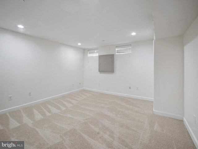 1705 E Chase St, Baltimore, MD 21213 - finished below grade area featuring electric panel, recessed lighting, light colored carpet, and baseboards