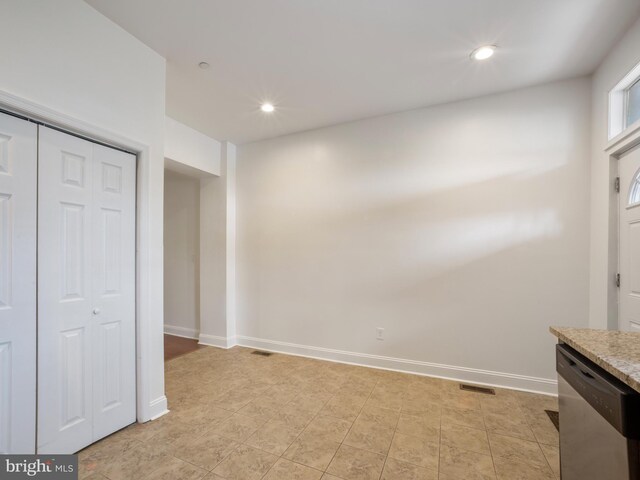 1705 E Chase St, Baltimore, MD 21213 - unfurnished bedroom with recessed lighting, baseboards, a closet, and light tile patterned flooring