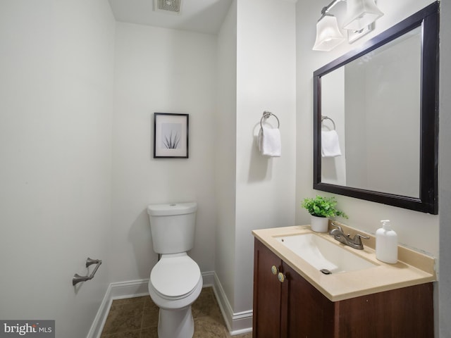 1705 E Chase St, Baltimore, MD 21213 - bathroom with baseboards, vanity, toilet, and tile patterned floors