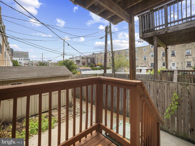 1705 E Chase St, Baltimore, MD 21213 - wooden terrace featuring a fenced backyard and a residential view