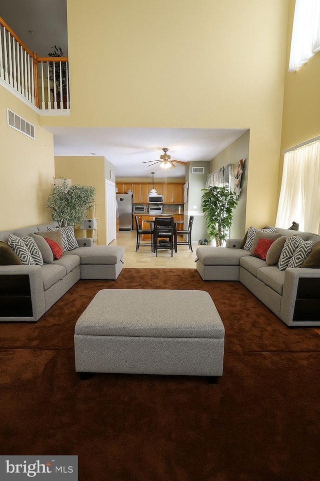 14 Riverside Rd, Dover, DE 19904 - living area with a high ceiling, light carpet, and a ceiling fan