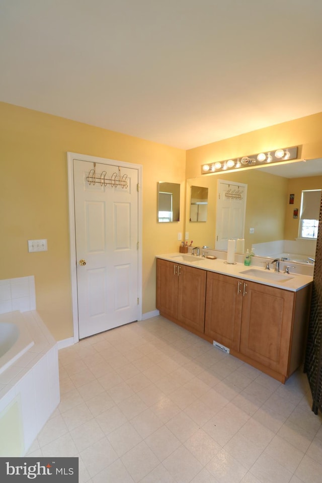 14 Riverside Rd, Dover, DE 19904 - full bathroom with double vanity and a relaxing tiled tub