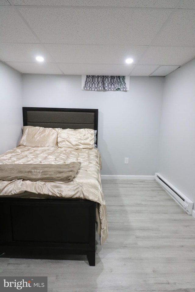 14 Riverside Rd, Dover, DE 19904 - bedroom featuring a baseboard radiator, a paneled ceiling, wood finished floors, and recessed lighting