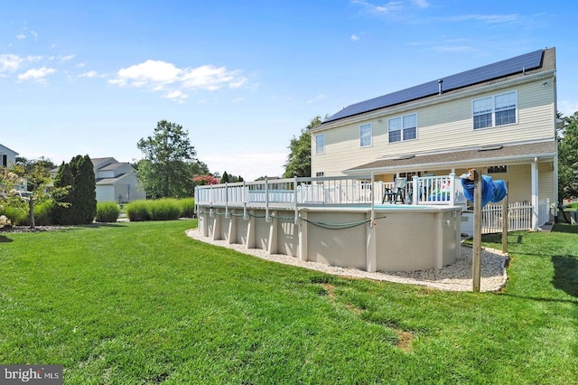 14 Riverside Rd, Dover, DE 19904 - rear view of house featuring an outdoor pool and a lawn
