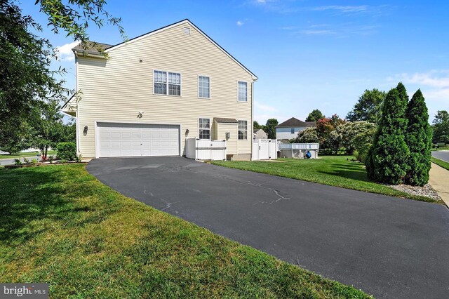 14 Riverside Rd, Dover, DE 19904 - view of front of property with driveway and an attached garage