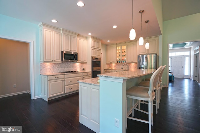 29486 Andrew Jackson Dr, Millsboro, DE 19966 - kitchen with stainless steel appliances, dark wood finished floors, backsplash, glass insert cabinets, and recessed lighting