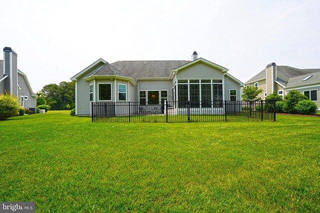 29486 Andrew Jackson Dr, Millsboro, DE 19966 - back of property with a sunroom and a chimney