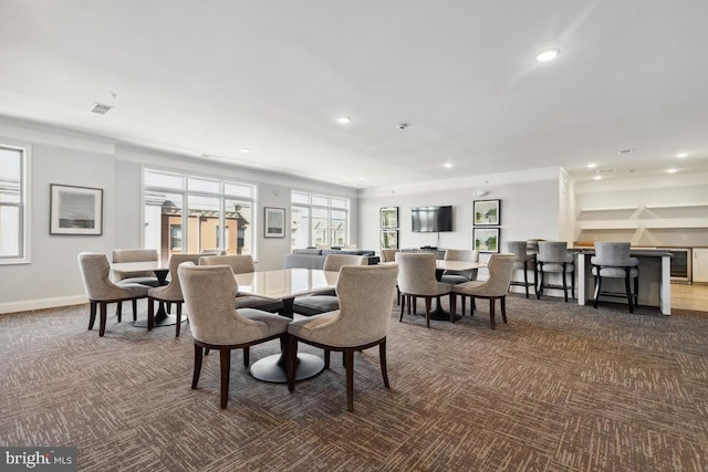 23630 Havelock Walk Ter Unit 205, Ashburn, VA 20148 - dining space featuring carpet floors, recessed lighting, beverage cooler, ornamental molding, and baseboards