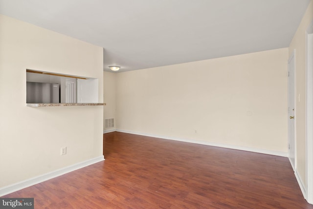 713 Brandywine St SE Unit 303, Washington, DC 20032 - spare room featuring wood finished floors and baseboards